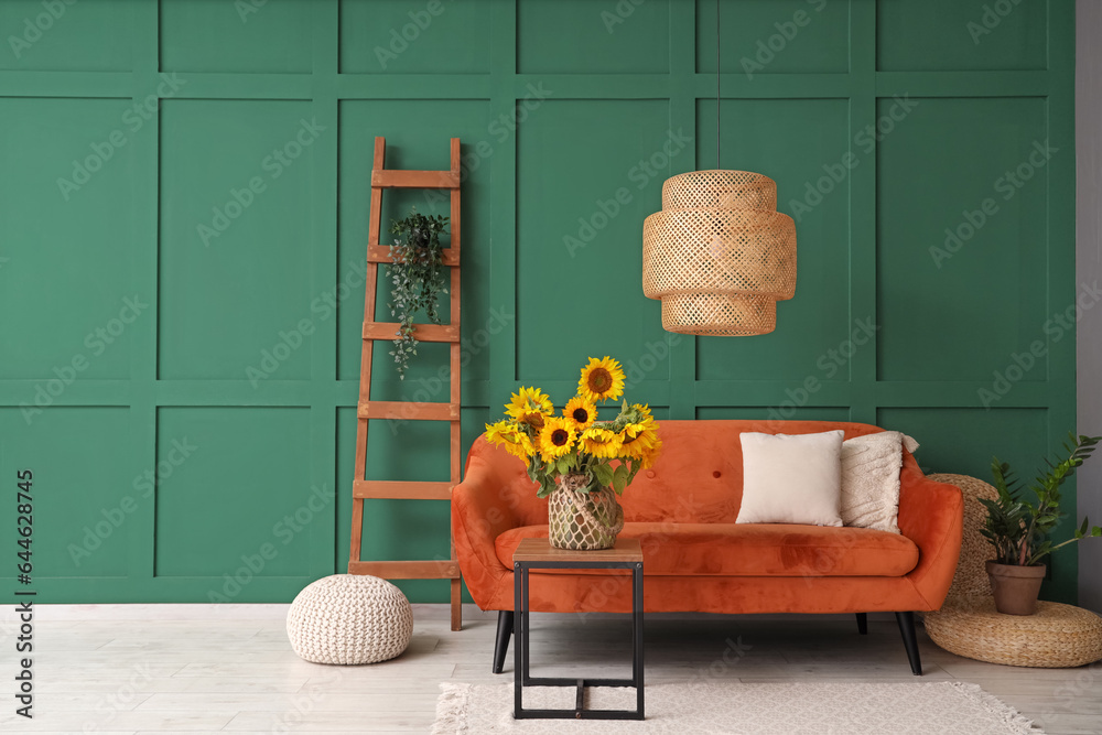 Vase with beautiful sunflowers on table in interior of living room