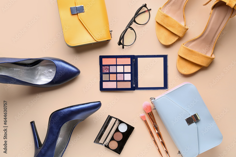 Composition with stylish female shoes, cosmetics and accessories on color background