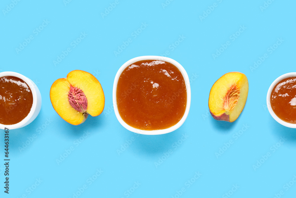 Composition with bowls of delicious peach jam on color background