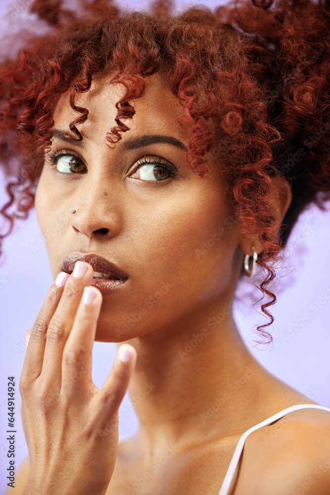 Touching lips, makeup and woman with cosmetics, shine and dermatology on a purple studio background.