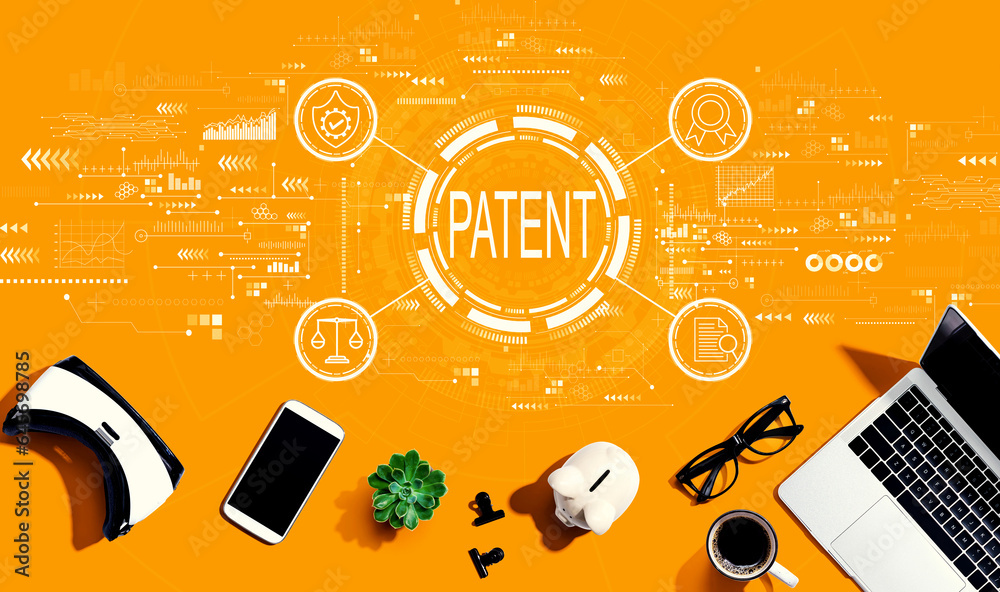 Patent concept with electronic gadgets and office supplies - flat lay