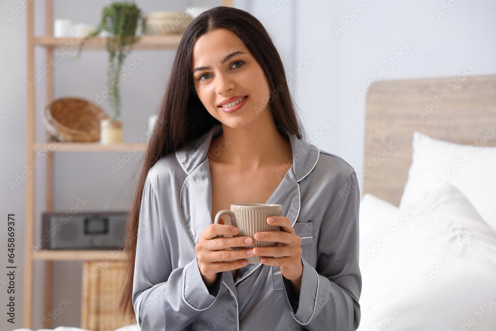 Morning of beautiful woman drinking coffee  in bed