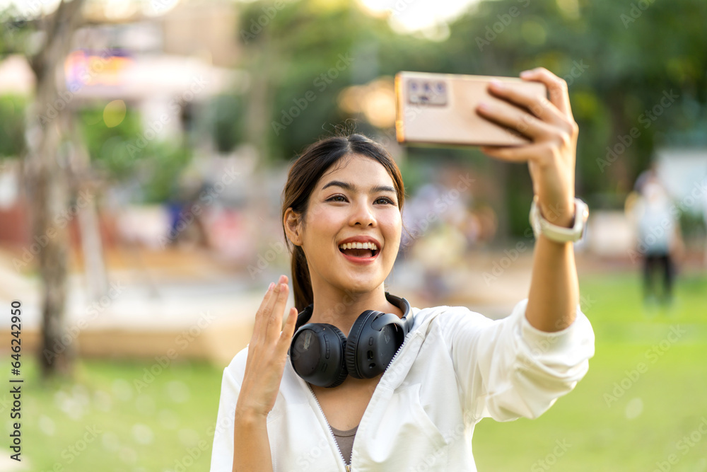 Portrait of smiling beauty asian woman posing look at camera making live selfie, content, vlogger, b