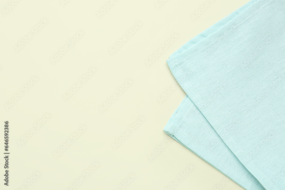 Clean folded napkin on color background