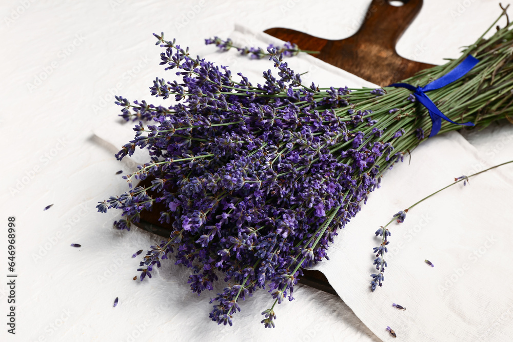 Bouquet of beautiful lavender flowers on light background, closeup