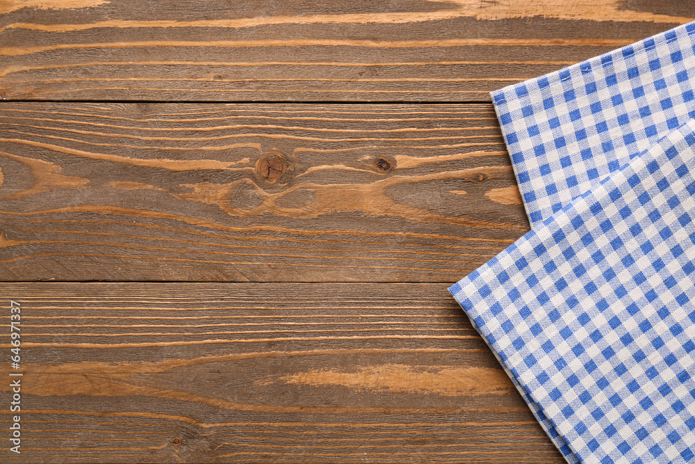 Clean cotton napkins on wooden background