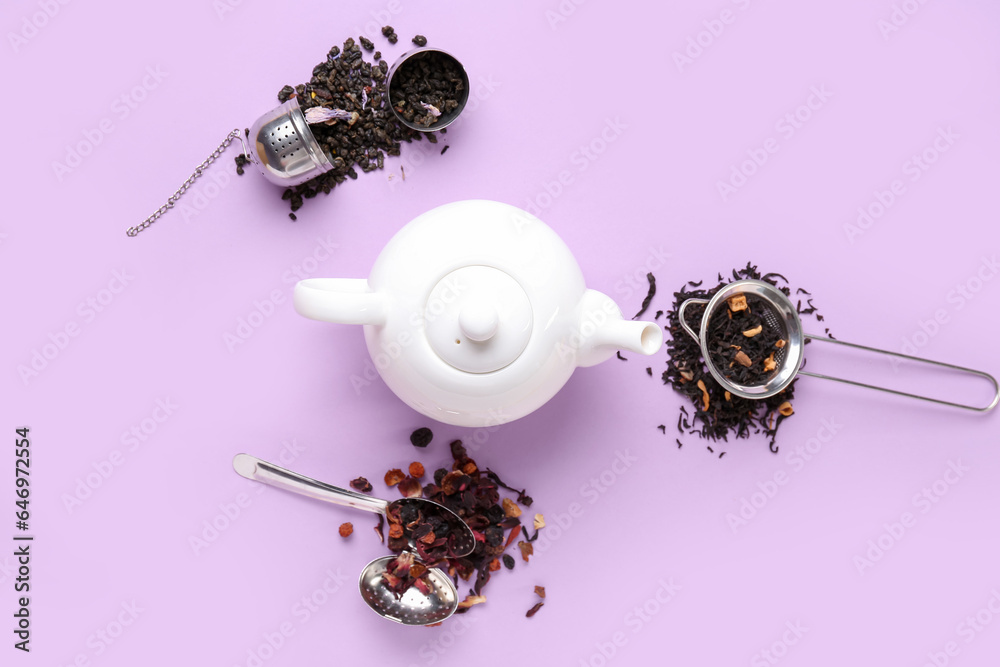 Composition with teapot and dried tea on color background