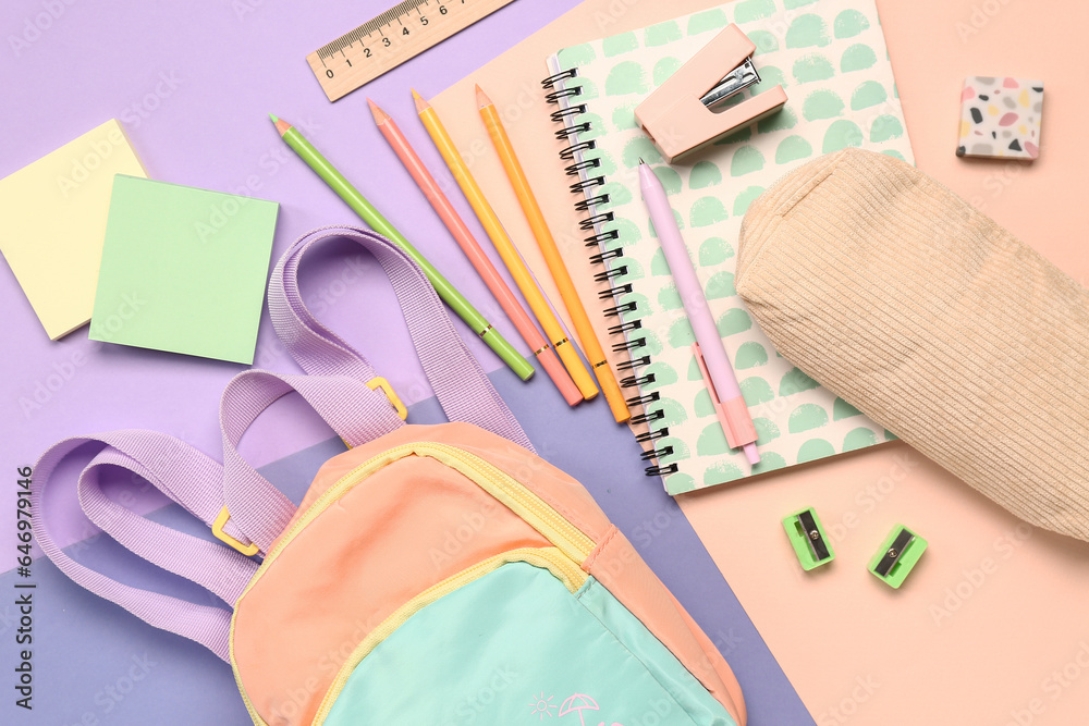 Stylish school backpack with different stationery supplies on colorful background