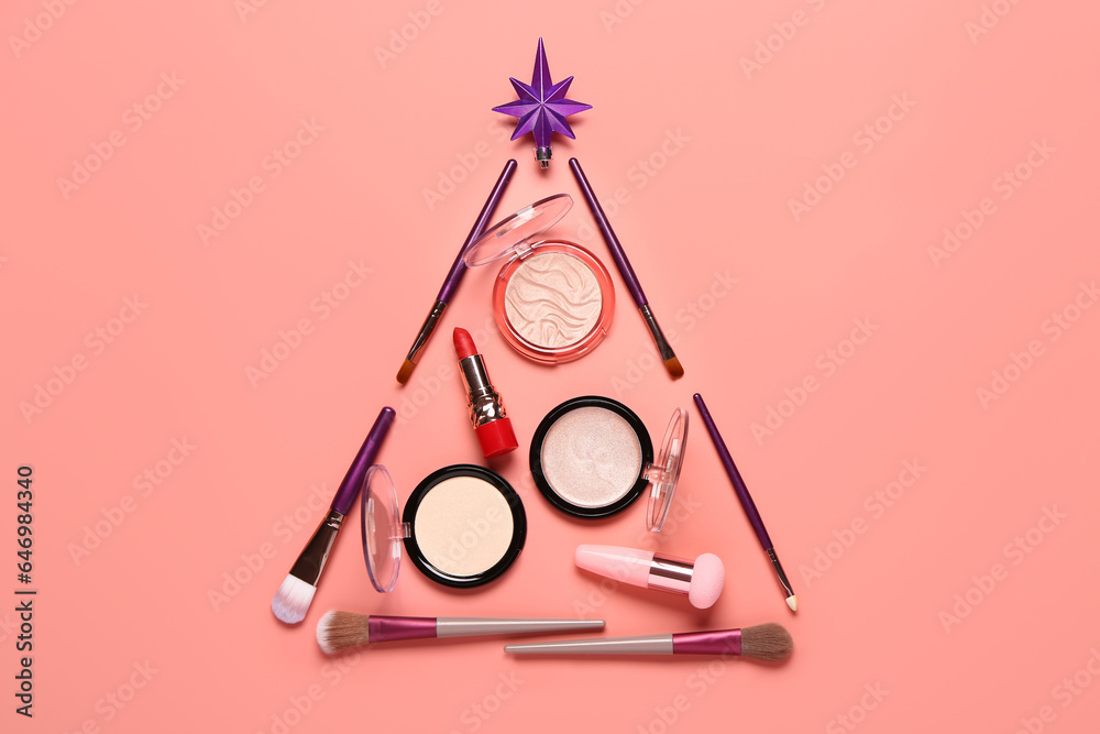 Beautiful Christmas tree made of makeup cosmetics on pink background