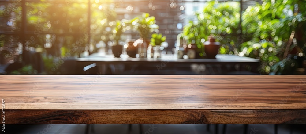 Bright daylight illuminates a modern cafe s blurred interior featuring a wooden table