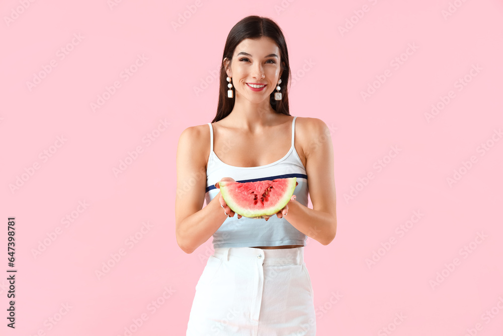 Young woman with fresh watermelon on pink background