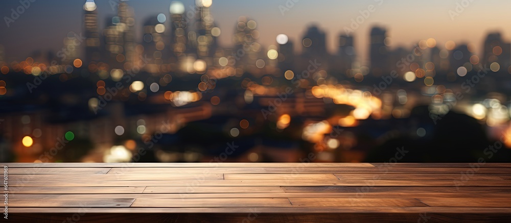 Brown wooden table with cityscape blur background and bokeh image selected for product display monta