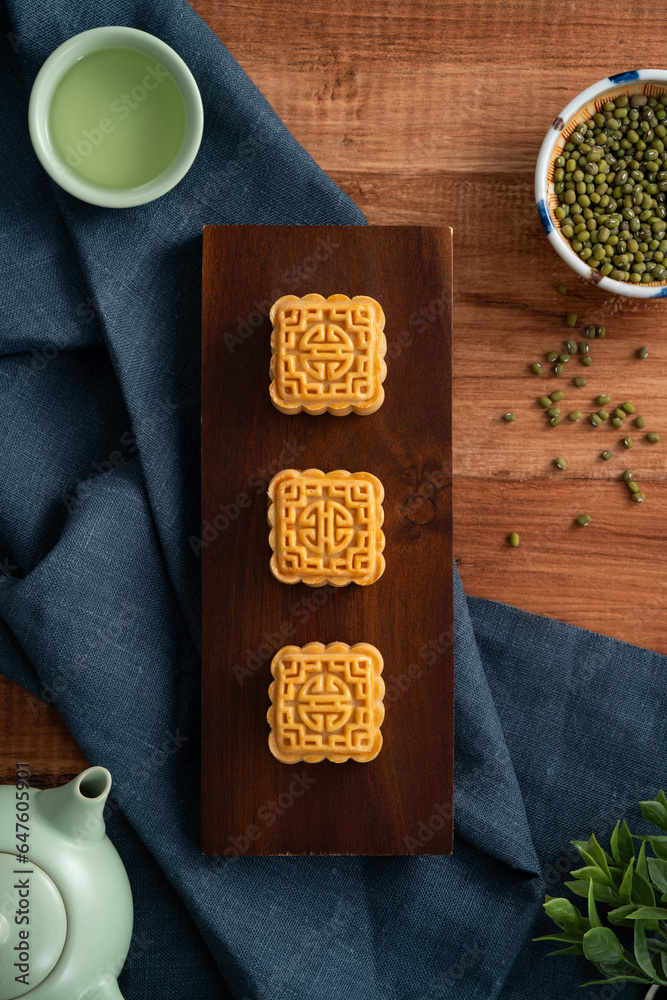 Delicious mung bean moon cake for Mid-Autumn Festival food mooncake on wooden table background.