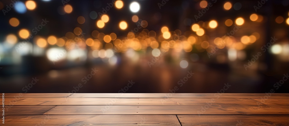 Empty brown wooden table with blurred background for photomontage or product display in coffee shop 