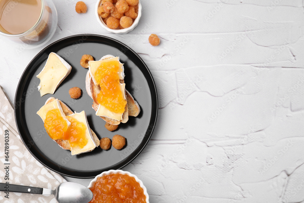 Tasty brie cheese sandwiches on white textured table, flat lay. Space for text