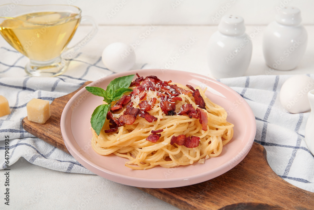 Plate with tasty pasta carbonara on white background