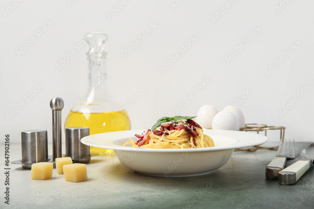 Plate with tasty pasta carbonara on table