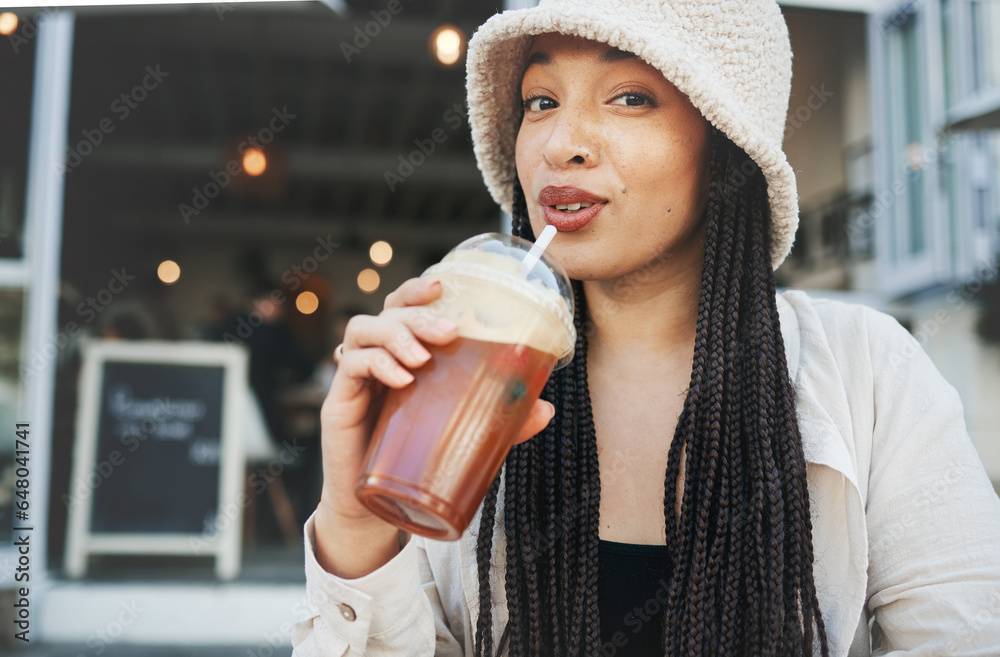 Woman, smoothie and portrait outdoor at a restaurant and drink from cafe with a smile. Milkshake, coffee shop and gen z fashion of a female person drinking from a straw on break on diner patio