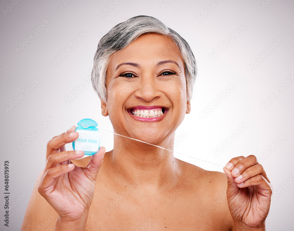 Mature woman, floss and studio portrait for transformation, beauty and healthy mouth by white background. Senior female model, teeth whitening and thread for dental self care, cleaning and change