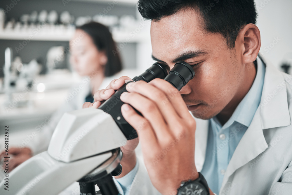 Microscope, face and man in laboratory for medical research, dna analysis or studying science, genes or particles. Scientist, biotechnology and lens for investigation, test or healthcare development