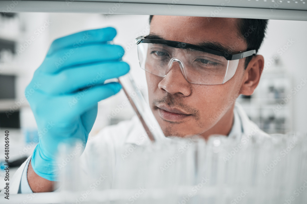 Lab scientist, test tube and face of man in laboratory studying chemical analysis, pharma research and vaccine development. Science, asian chemistry technician and assessment of sample for innovation