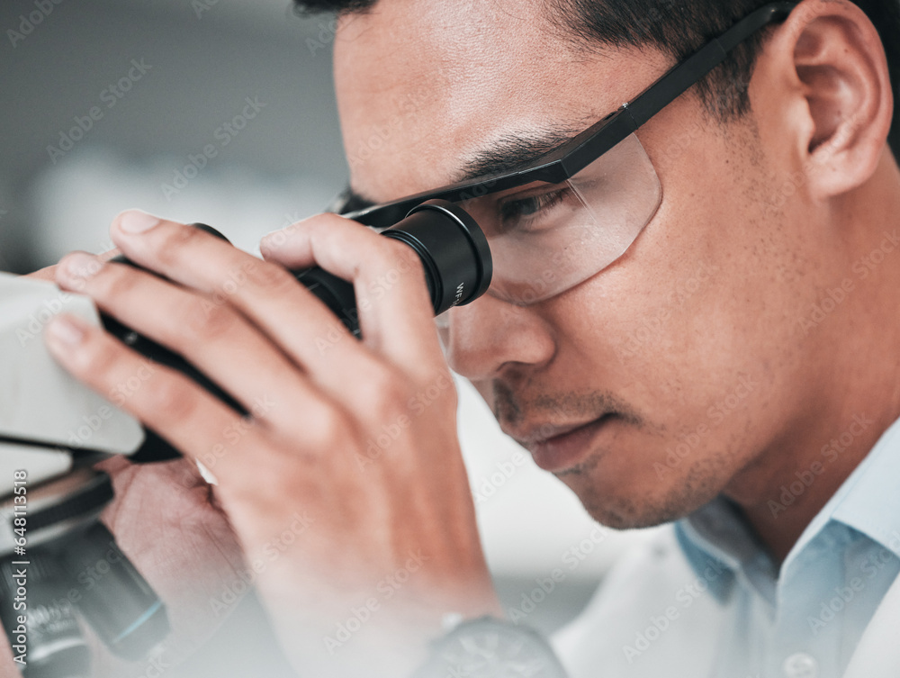 Microscope, face and man in medical laboratory for research, dna analysis or development of science innovation. Asian scientist, biotechnology or check lens for investigation, particles or assessment