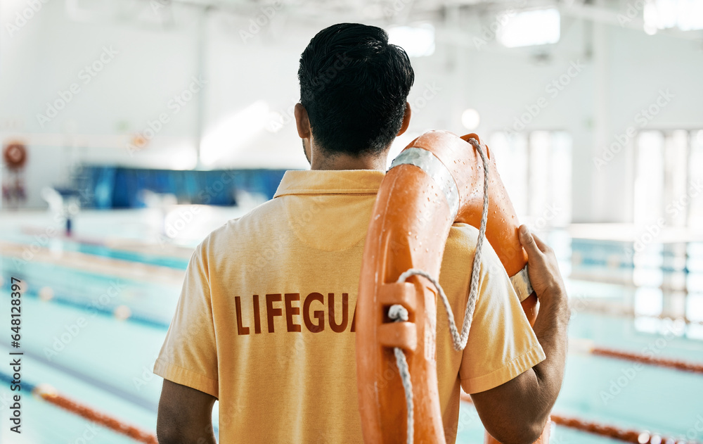 Lifeguard, back and person with swimming, pool or safety lifebuoy for rescue support, help or life saving. Surveillance attention, equipment and expert for protection, security or medical emergency