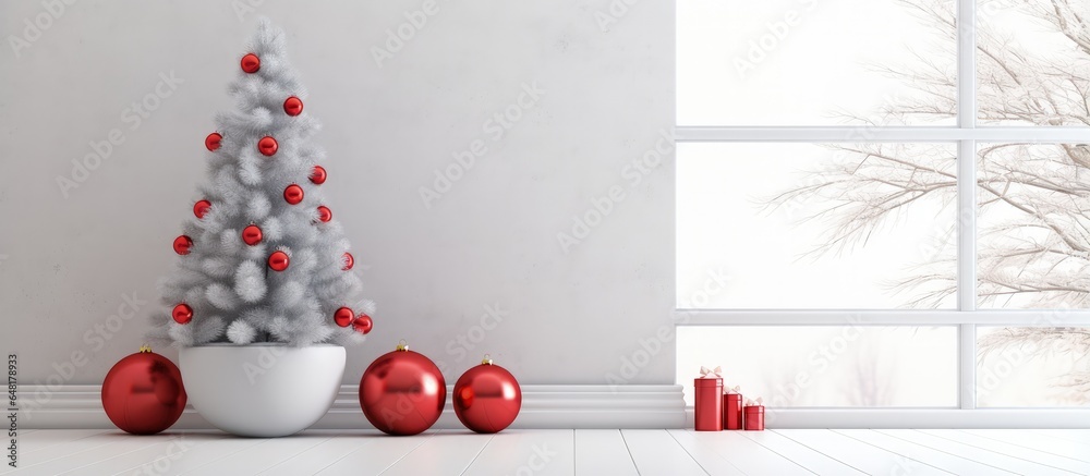 Red and white baubles on a Christmas tree branch indoors