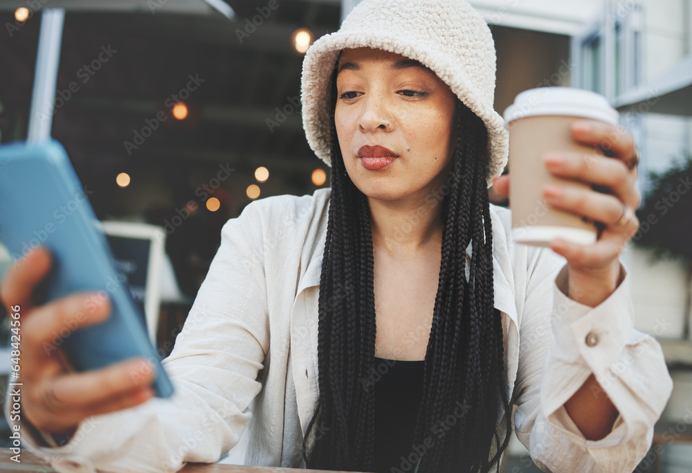 Phone, networking and woman with a coffee in the city typing a message on the internet. Technology, latte and female person scroll on social media or mobile app with cellphone at restaurant in town.