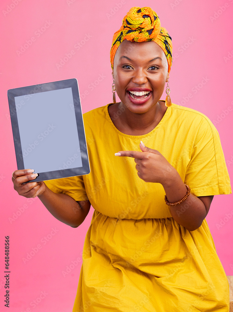 Happy black woman, portrait and pointing to tablet mockup in advertising against a studio background. African female person smile showing technology display, screen or mockup for deal, app or sale