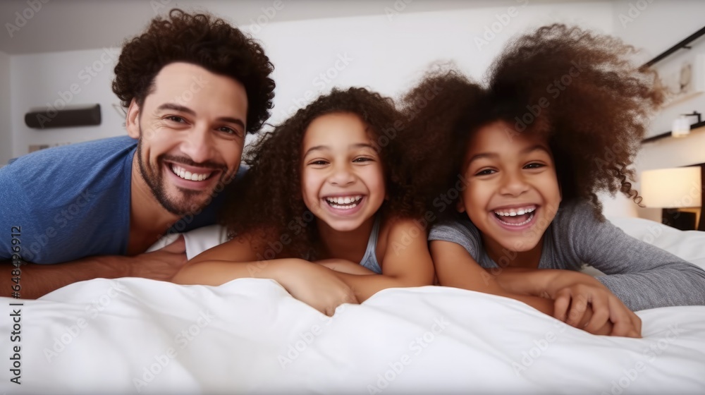 Happy family kids and parents rest on bed, Enjoy morning together, Bedroom portrait.