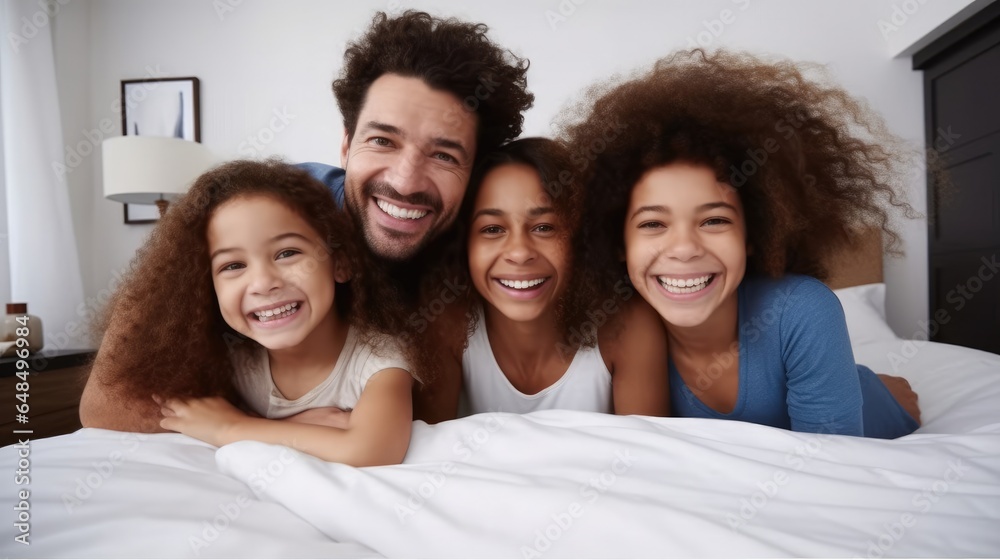 Happy family kids and parents rest on bed, Enjoy morning together, Bedroom portrait.