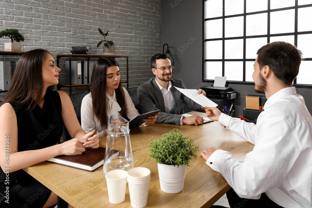 Human resources commission interviewing male applicant in office