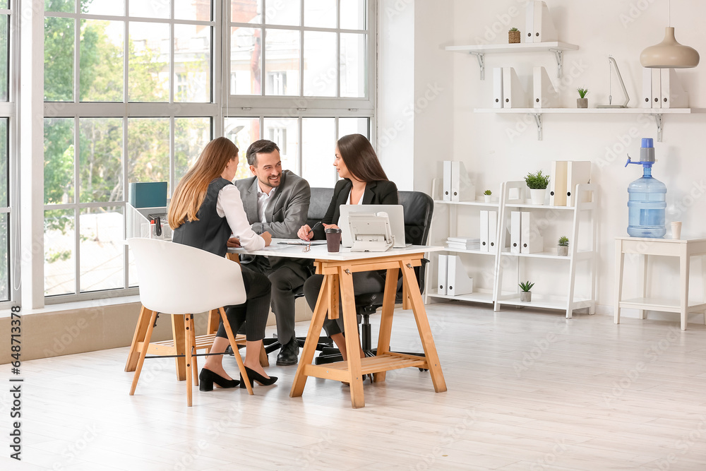 Human resources commission interviewing female applicant in office