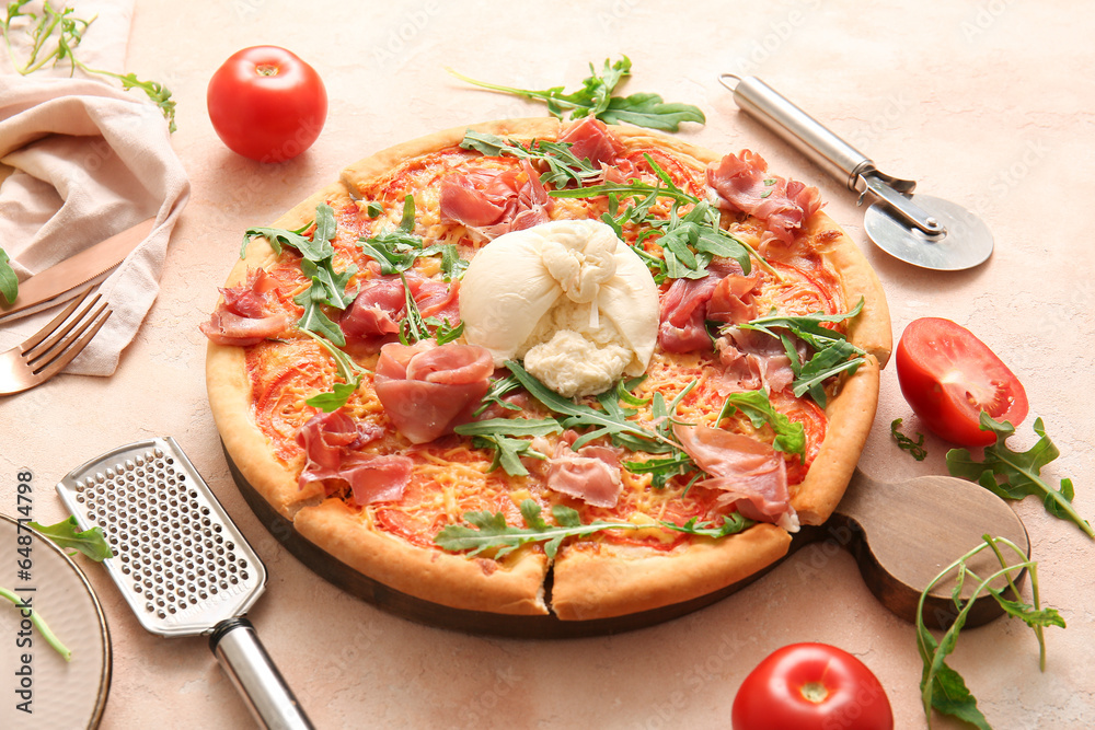 Wooden board of tasty pizza with Burrata cheese on beige background