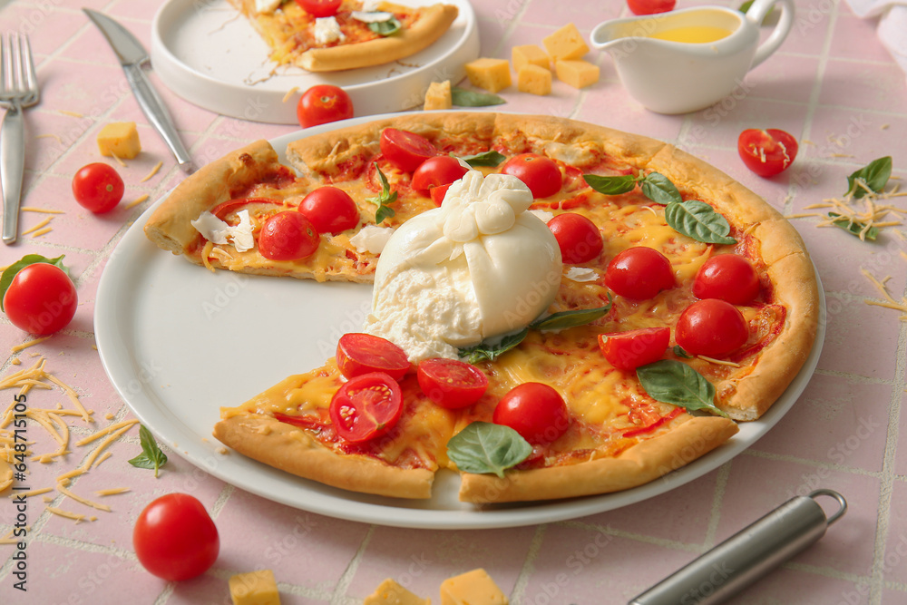 Plate of tasty pizza with Burrata cheese on pink tile background