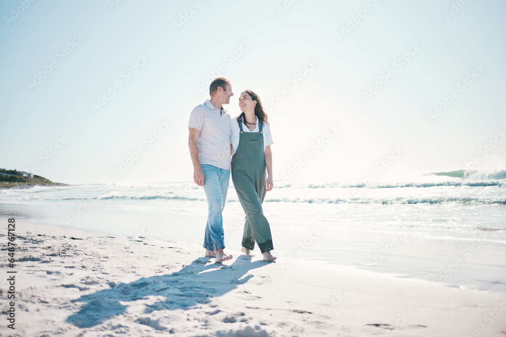 Beach, happy couple or walking in love on vacation, holiday or bonding in summer on mockup space. Smile, man or woman at ocean to travel, romance or healthy connection in relationship at sea together