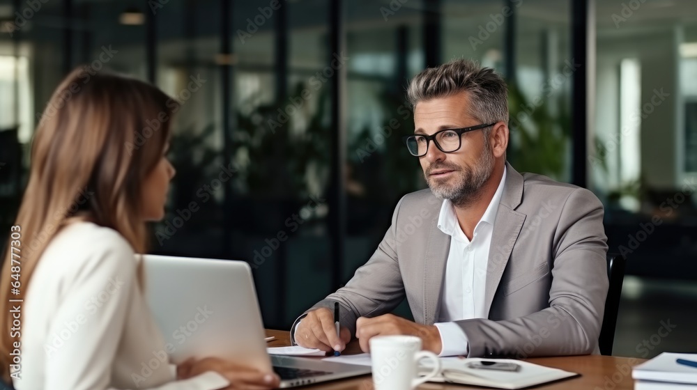 Two mature business executives having conversation at meeting, Discussing about digital corporate strategy in office.