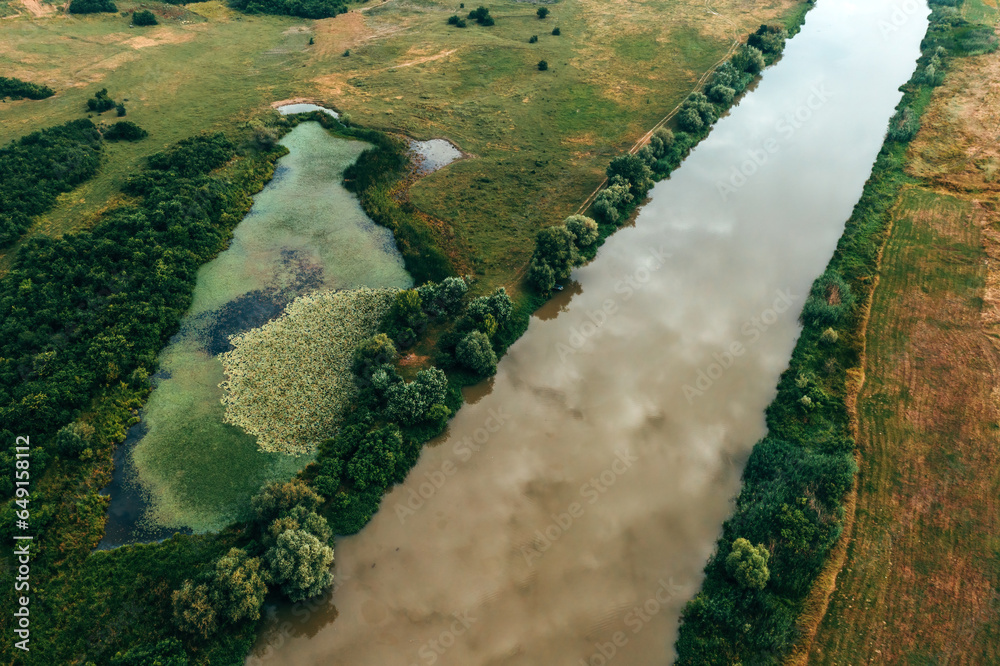 Aerial shot of Tamis river in plain landscape of Serbian province Vojvodina