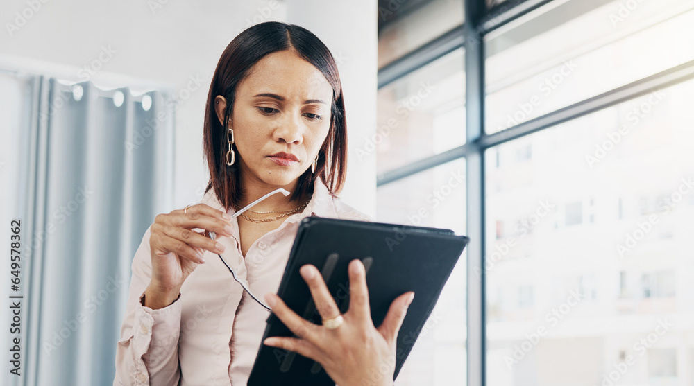 Woman in office, reading and thinking with tablet for email, HR schedule or report online for feedback. Research, networking and communication on digital app, businesswoman at human resources agency.