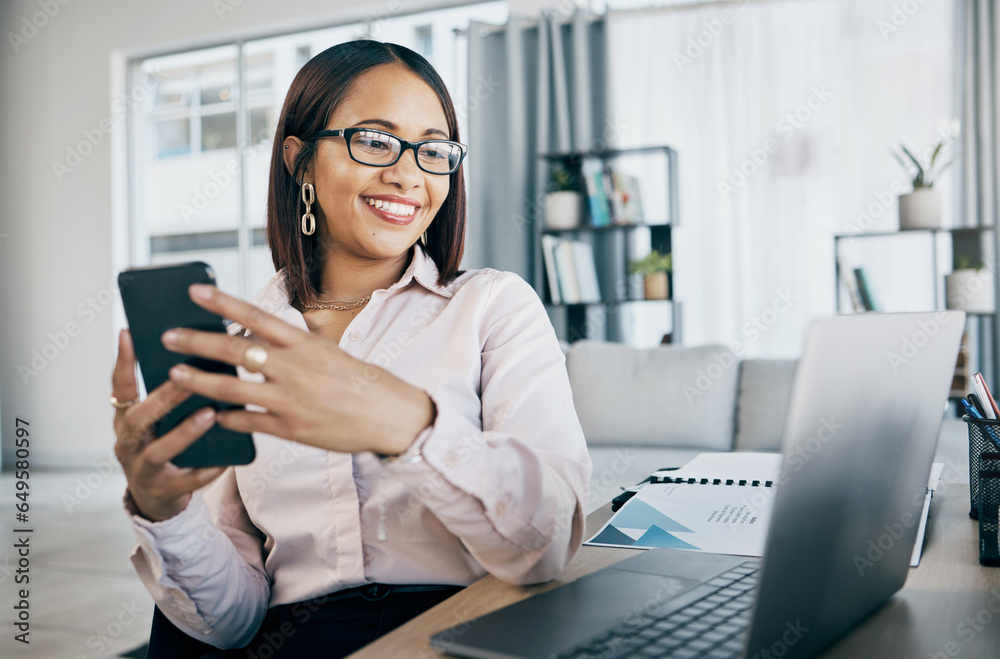 Phone, laptop and businesswoman in the office typing an email or networking on internet. Communication, technology and professional female designer doing creative research on cellphone and computer.