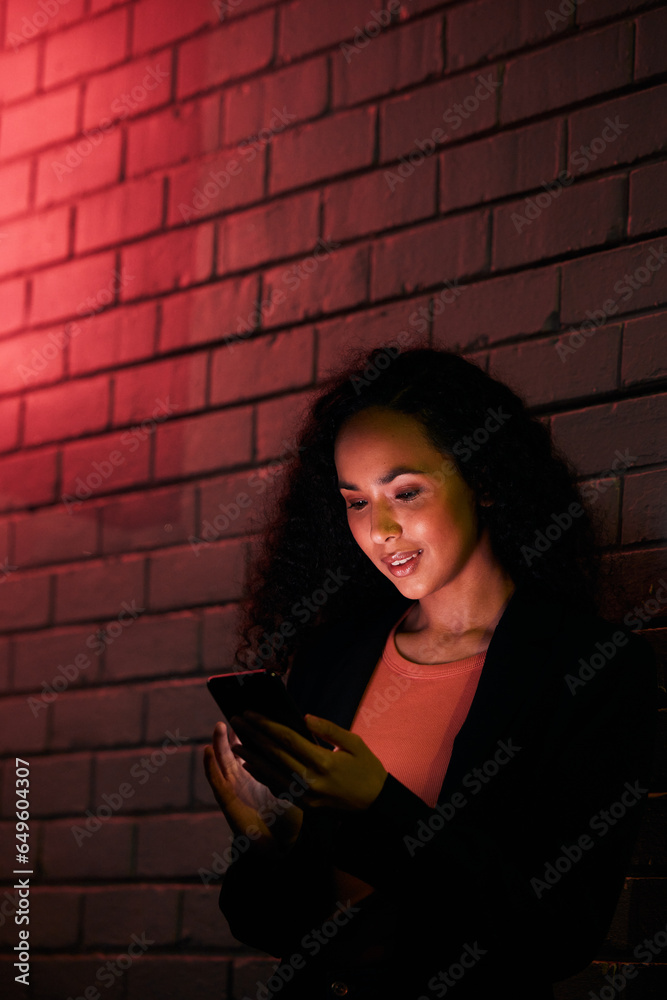 Phone, city night wall and woman typing, search internet or check mobile info, app or contact social media user. Red neon light, communication and person networking, relax or research cellphone news