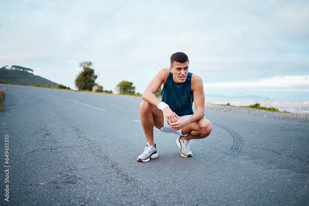 Sports, nature and man athlete breathing on break of race, marathon or competition training and workout. Fitness, fatigue and tired young male runner resting for outdoor cardio exercise for endurance