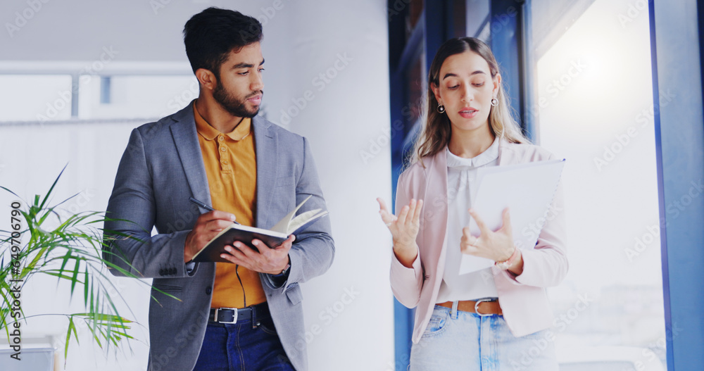 Collaboration, planning and a business team walking in the office while talking about strategy or the company mission. About us, teamwork and documents with professional people writing in a notebook