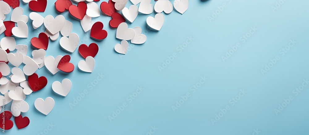 Valentine s Day concept with white and red hearts on a pastel blue background Flat lay top view copy space