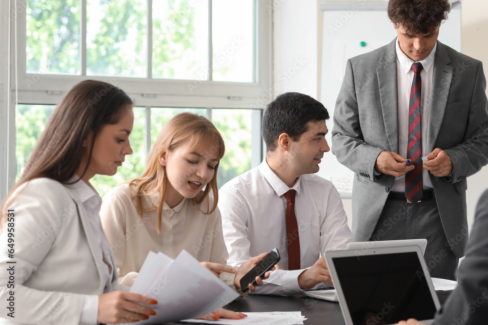 Group of business consultants working in office