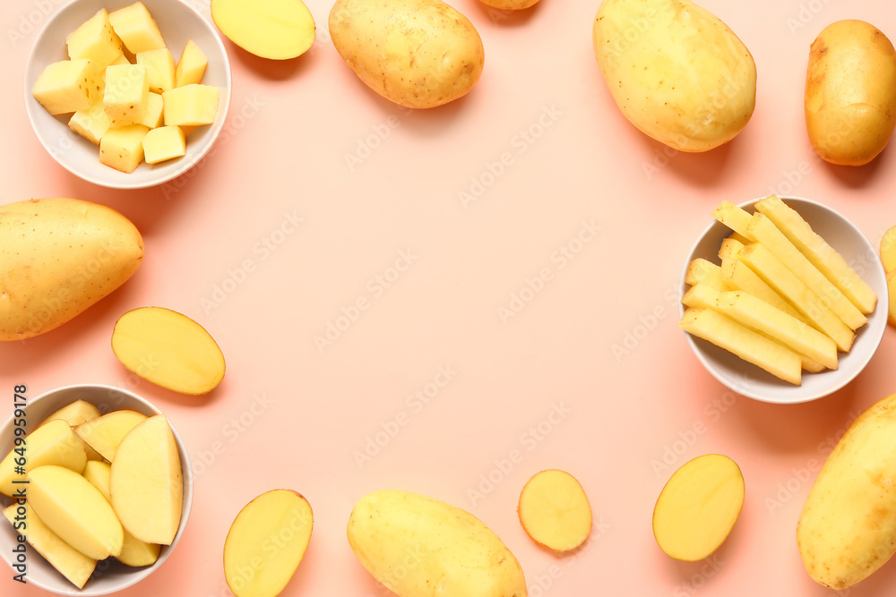 Frame made of cut and whole potatoes on pink background