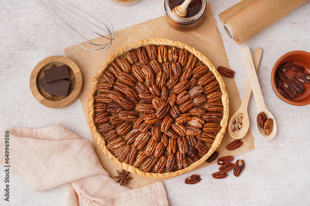 Tasty pecan pie on light background