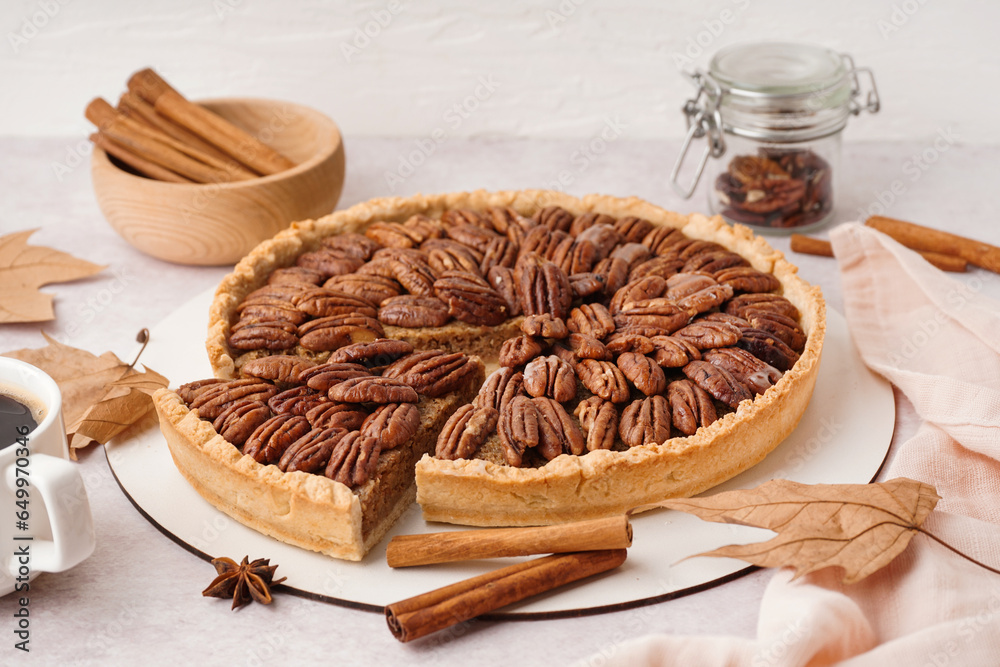 Tasty pecan pie on light background