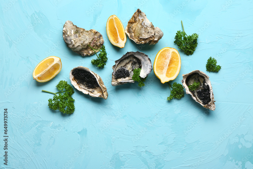 Tasty oysters with lemon and black caviar on blue background